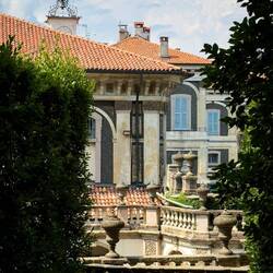Glimpse of the palazzo through the trees in one of the gardens — Isola Bella, Stresa.