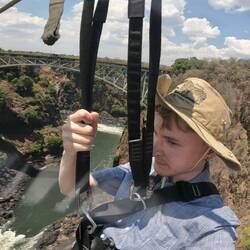1 Using zipline that crosses canyon with about 100m drop
