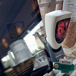 Place your order on the tablet, click the green thing to the white robot thingy, order placed.