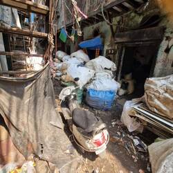 A street/ alley.Note the door space ,a whole family will live in there