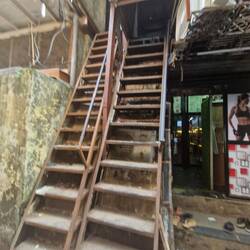 Steep stairs for climbing to dry the plastic on the roof
