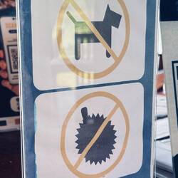 At check in. Two things that are not allowed. Note: durian fruit is probably more smelly than a dog.