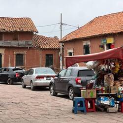 The town square with stalls and rickety balconies