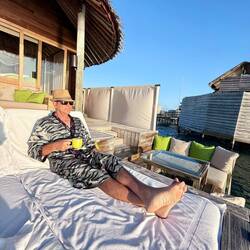 Really embracing retirement ... tiger robe engaged... first sunrise in Maldives.