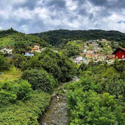 Chiesa di San Giorgio and hillside view from the bridge — Cannero Riviera, Italy.