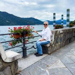 Stone seats built into the wall along the promenade offer a place to rest and enjoy the lake views.