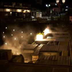More foot bath hot springs with communal seating besides the river