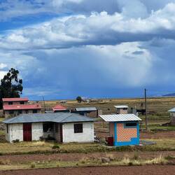 The blue and brick buildings are the new toilet blocks for each house
