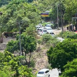 Queues of tourists being driven around contributing to overcrowding and infrastructure strain