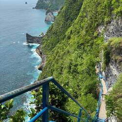 Blue staircases leading down to Guyangan waterfall