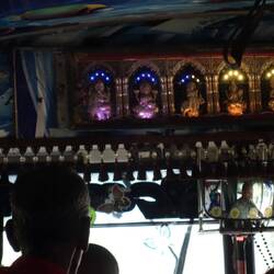 The buses are always 'blinded up' with religious trinkets. eg a row of small buddhist shrines.