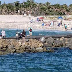 Fishers crowd the rock wall (I won't call it a 'mole', for Preston's sake)