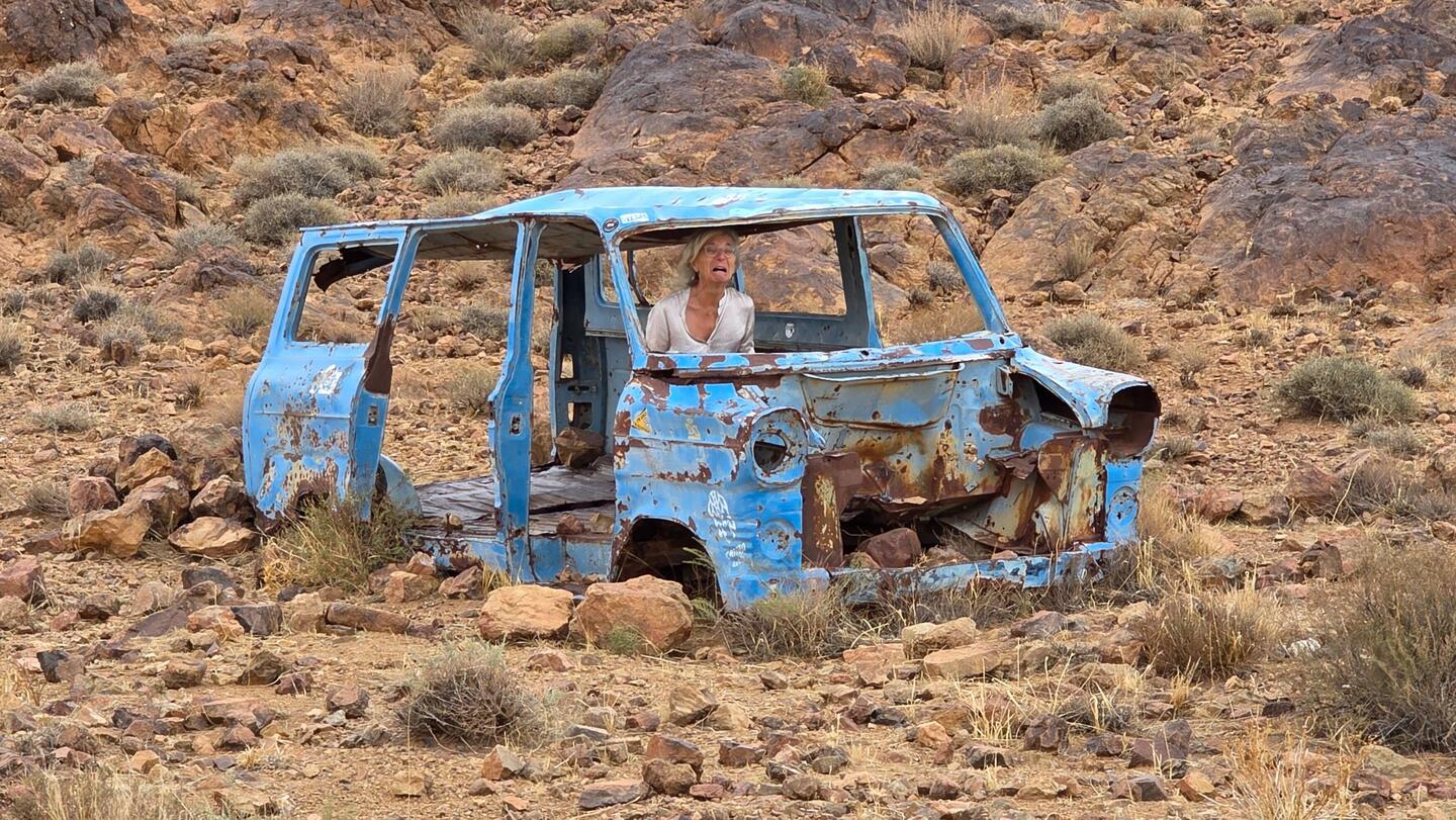 Elfi doing her best using all "diff-locks" and reduction to get this stuck car out of its dilemma
