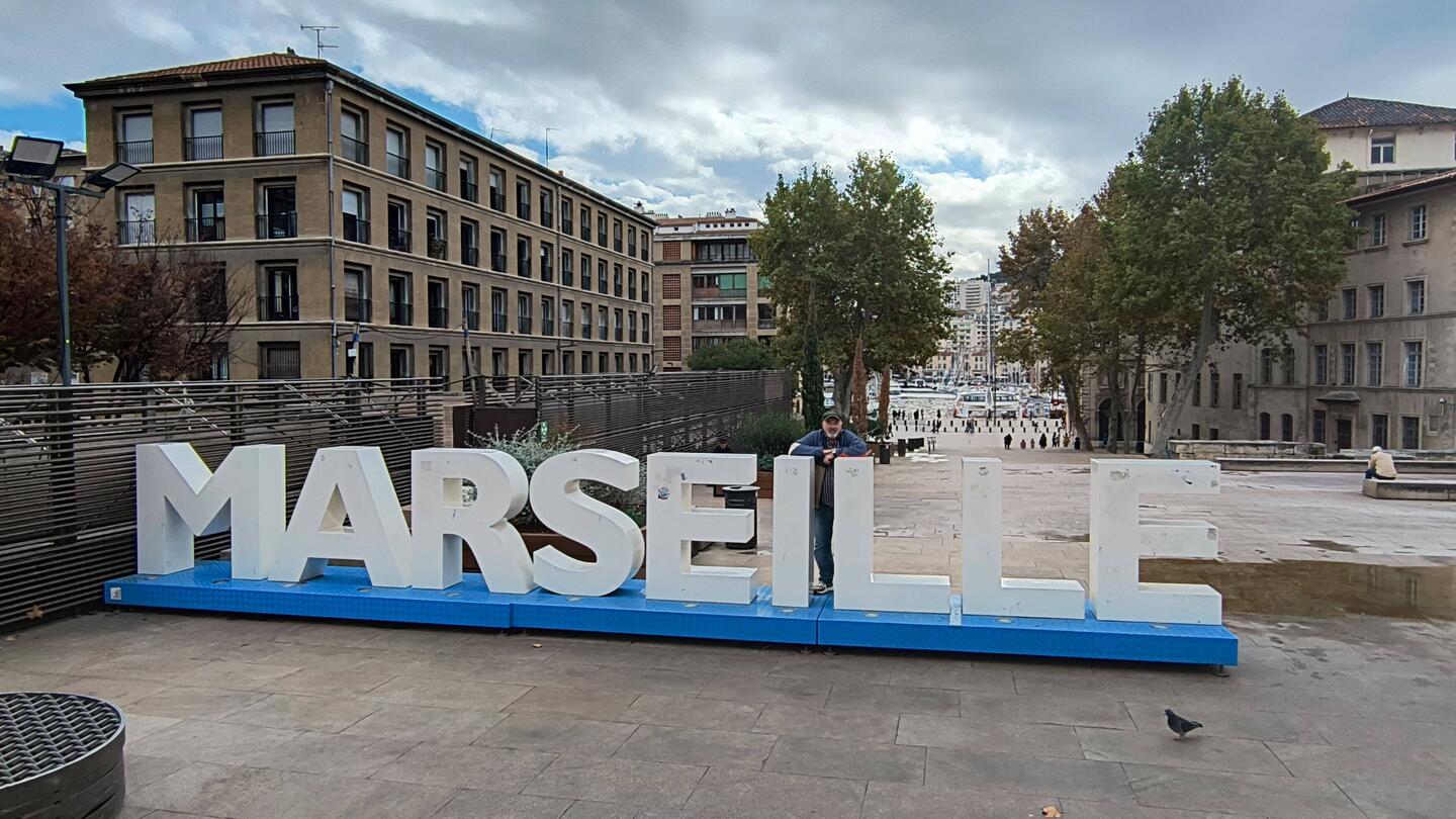 I am standing between the "I" and "L".