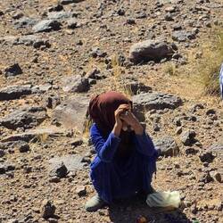 This little girl spreads out her "wares" in front of our car and just waits silently till we buy.