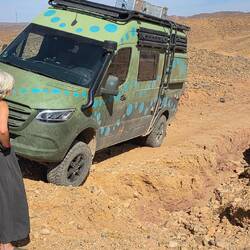 Our first real off-road challenge. The front wheel has slipped into a gully, getting deeper