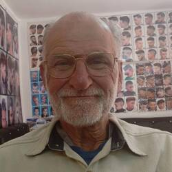 Alain takes advantage of the exchange rate to get a hair cut.