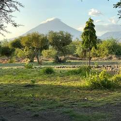 The big volcano with volcanic ash on the top.
