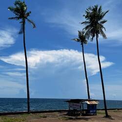 A storm cloud forms out to sea