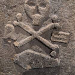 Pre 1700's this was a typical marking for a gravestone, with MAYBE the deceased's name on the back