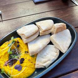 Pumpkin tumeric hummus with zatar and pita