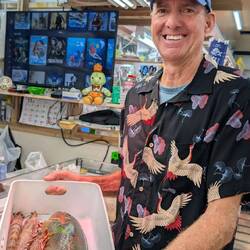 We selected our seafood for lunch at the market.