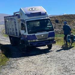 This truck is closer to Alain than to his side of the road!