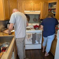 Katie put Nate to work cutting up the turkey.