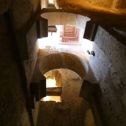 The horseshoe arches are remnants of the former minaret