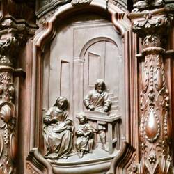 Many biblical scenes are carved into the choir panelling
