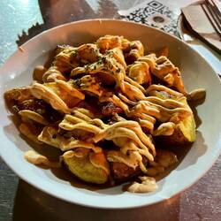 Patatas mozárabe, with randomly spiced mayonnaise and sauce