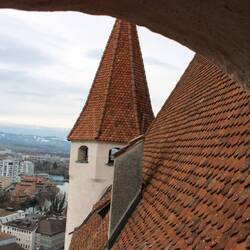 Across the terracotta roof to the next turret. Mennonites hid and were hunted in the snowy valleys.