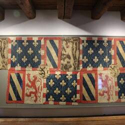 Tapestry spoils of war rolled around the altar cloths.