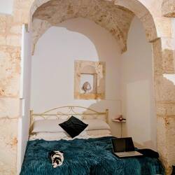 Traditional houses are small, cubical, made from limestone and often have star vaulted roofs.