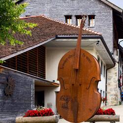 "Music Soothes the Soul" ... in front of the Tourist Info Center — Gruyères, Switzerland.