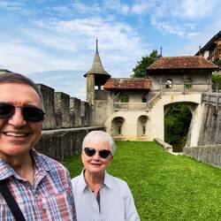 Ramparts of the old city walls and a watchtower near Belluard Gate — Gruyères, Switzerland.