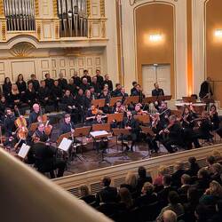 The orchestra tuning, preparing for the Maestro.