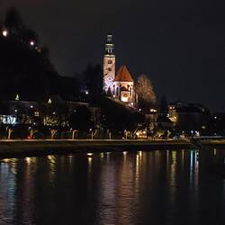 The church down the way on the other side of the bridge.