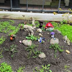 A gnome garden with a statue of David thrown in