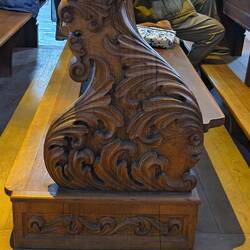 The carving on the pew where we sat