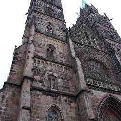 Legend has it the contractors could not agree on a design for the towers, so they built differently.