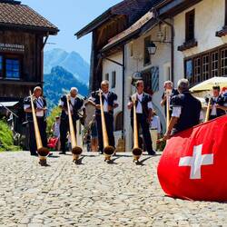 Alpenhorn group preparing to entertain visitors — Gruyères, Switzerland.