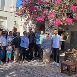 Good bye group photo at the guest house in Kong