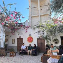 In the background: a wind tower for air condition. Kong has lots of them to cool down the patios