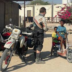 Local kids, living the beach life, curious about foreigners