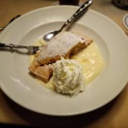 Apple strudel.l with vanilla cream sauce.