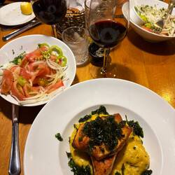 Grilled salmon over a corn pudding-ish mash and the Chilean tomato salad that brought some heat!