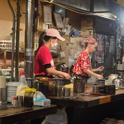 Ladies cooking okonomiyaki