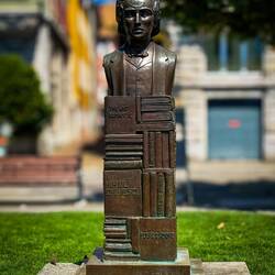 Bust of Mihai Eminescu, a Romanian poet, on a pedestal of books — Vevey, Switzerland.