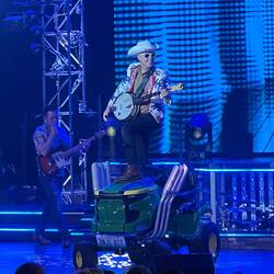 Banjo boy came in on a souped up riding lawn mower.